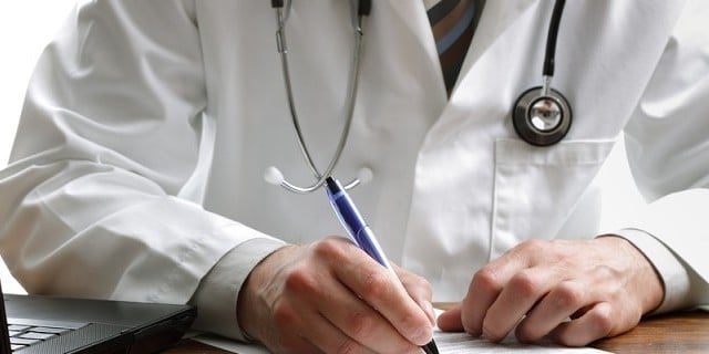 Doctor writing